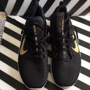 Nike Air Max. Black with gold lettering and swoosh. Women’s size 12.